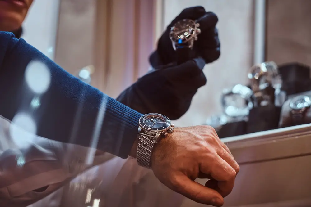 Man trying on branded watch