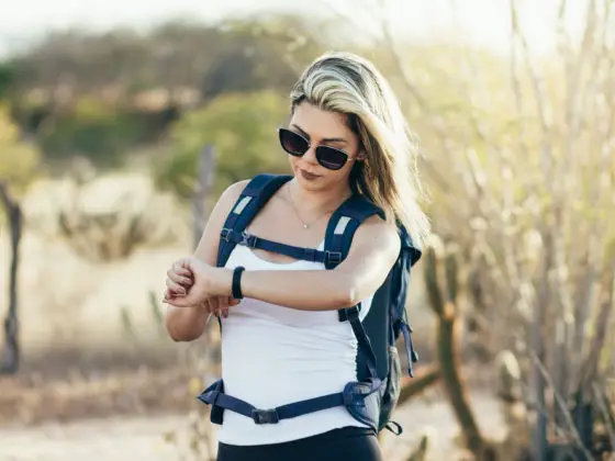 Hiker looking at her GPS Watch