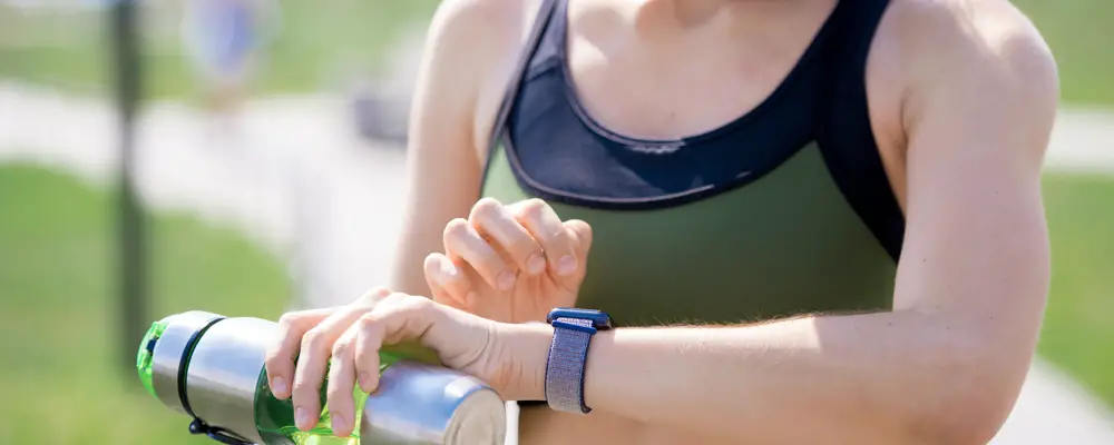 Active Woman Checking Smart Watch