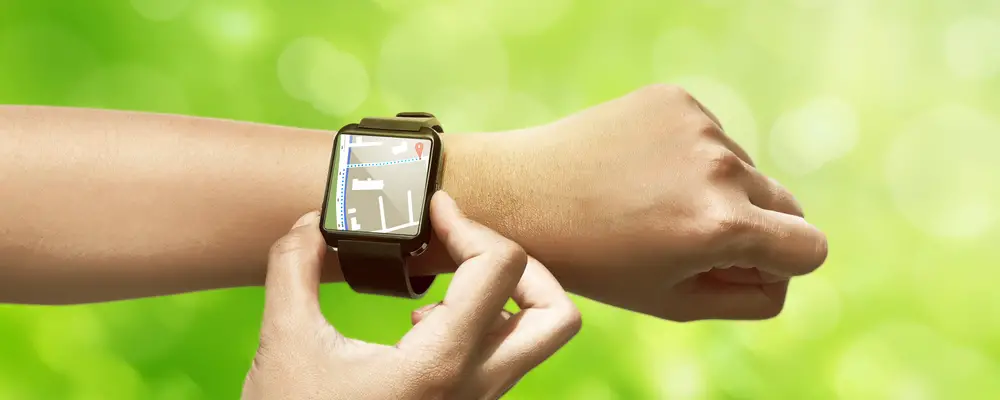 Hand setting route for GPS on the smart watch. Technology concept