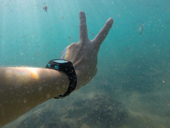 Man underwater with wrist watch