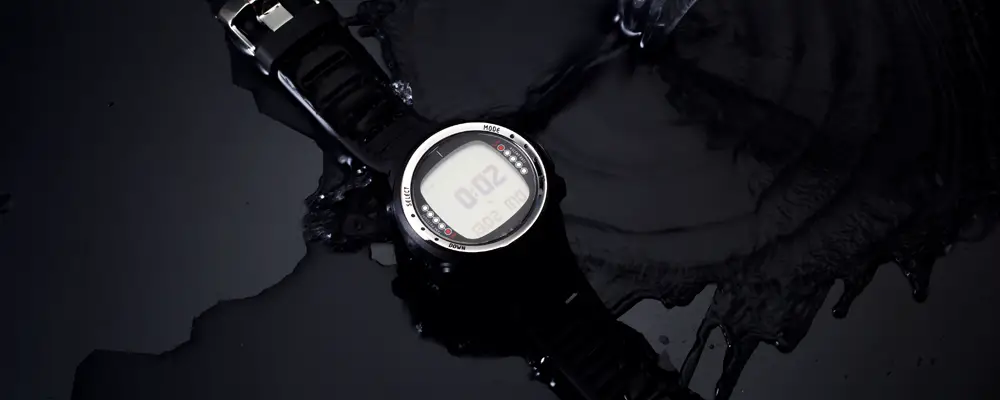 Watches for scuba diving in streams of water on a black background, studio light