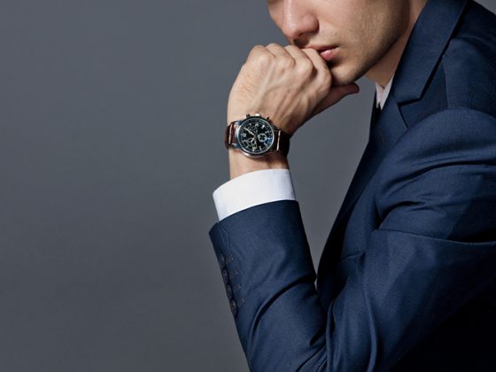 Man in an expensive suit and watch